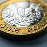 bigstock-one-british-pound-coin-lies-on-417342622